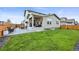 Beautiful backyard features a patio, green lawn, and a fenced boundary at 17765 Faraday St, Broomfield, CO 80023