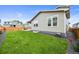 Beautiful backyard with lush lawn and privacy fence offers room to enjoy the outdoors at 17765 Faraday St, Broomfield, CO 80023