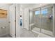 Modern bathroom showcasing a glass-enclosed shower with tiled walls and ample natural light at 17765 Faraday St, Broomfield, CO 80023