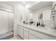 Bathroom featuring double sinks, sleek countertops, and modern fixtures for a clean, stylish design at 17765 Faraday St, Broomfield, CO 80023