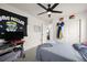 Comfortable bedroom features a modern ceiling fan, closet, and stylish decor at 17765 Faraday St, Broomfield, CO 80023