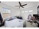Comfortable bedroom with a fan, and a desk area, creating a functional and cozy space at 17765 Faraday St, Broomfield, CO 80023