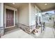 Inviting covered front porch with seating area, perfect for relaxing and enjoying the outdoors at 17765 Faraday St, Broomfield, CO 80023