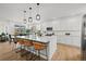 This kitchen offers a large island, pendant lighting, stainless appliances and light colored cabinets at 17765 Faraday St, Broomfield, CO 80023