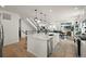 Bright kitchen with stainless appliances, large island, and an open floor plan at 17765 Faraday St, Broomfield, CO 80023