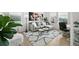 Cozy living room featuring stylish decor and a large window that offers lots of natural light at 17765 Faraday St, Broomfield, CO 80023
