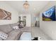 Upstairs living room with comfortable gray sectional and decorative accents, with a view of the stairs at 17765 Faraday St, Broomfield, CO 80023