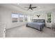 Spacious bedroom featuring large windows, a ceiling fan, and neutral decor for a bright, airy feel at 17765 Faraday St, Broomfield, CO 80023