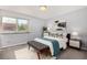 Bright bedroom with a comfortable bed, soft rug, and natural light streaming through the window at 1260 York St # 204, Denver, CO 80206
