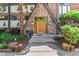 Charming entryway with stone facade and wooden door framed by decorative glass sidelights at 1260 York St # 204, Denver, CO 80206