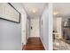 Hallway leading to the main entrance and an open kitchen/dining area with modern design at 1260 York St # 204, Denver, CO 80206