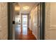 Hallway featuring hardwood flooring and access to multiple rooms at 1260 York St # 204, Denver, CO 80206
