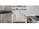 Modern kitchen featuring stainless steel appliances, white cabinets, and sleek countertops at 1260 York St # 204, Denver, CO 80206