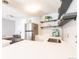 Modern kitchen features stainless steel refrigerator, floating shelves, and lots of counter space at 1260 York St # 204, Denver, CO 80206