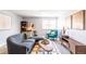 Inviting living room featuring a comfortable sofa, a bright window, and a classic layout perfect for relaxing at 1260 York St # 204, Denver, CO 80206