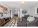 Inviting living room featuring a comfortable gray sectional sofa, stylish decor, and an open layout at 1260 York St # 204, Denver, CO 80206