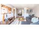 Charming living room with neutral tones, stylish furniture, and an open layout to the dining area and kitchen at 1260 York St # 204, Denver, CO 80206