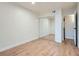 Bedroom with wood floor and mirrored closet at 8335 Fairmount Dr # 11-203, Denver, CO 80247