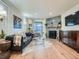 Inviting living room with a stone fireplace, modern decor, and a sliding glass door at 8335 Fairmount Dr # 11-203, Denver, CO 80247