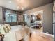 Spacious main bedroom with mirrored closet doors and large windows overlooking the exterior at 8335 Fairmount Dr # 11-203, Denver, CO 80247