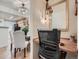 Office nook with a view to the dining area and kitchen, and featuring a custom desk at 8335 Fairmount Dr # 11-203, Denver, CO 80247