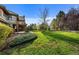 Expansive backyard featuring lush greenery, mature trees, and a patio area, perfect for outdoor entertaining at 4282 Preserve N Pkwy, Greenwood Village, CO 80121