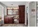 Bathroom with vanity, large mirror, and linen closet at 4282 Preserve N Pkwy, Greenwood Village, CO 80121