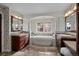 Primary bathroom with soaking tub and double vanities at 4282 Preserve N Pkwy, Greenwood Village, CO 80121