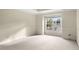 Bright bedroom with large window and neutral decor at 4282 Preserve N Pkwy, Greenwood Village, CO 80121