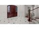 Bright and spacious foyer with a stunning dark wood door and tile flooring at 4282 Preserve N Pkwy, Greenwood Village, CO 80121