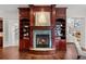 Elegant fireplace with built-in shelving and marble surround at 4282 Preserve N Pkwy, Greenwood Village, CO 80121