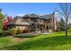 Luxury home with stone accents and a backyard patio at 4282 Preserve N Pkwy, Greenwood Village, CO 80121