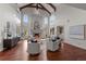 Two-story living room with a grand fireplace and abundant natural light at 4282 Preserve N Pkwy, Greenwood Village, CO 80121