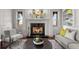 Cozy living room featuring a marble fireplace and built-in shelving at 4282 Preserve N Pkwy, Greenwood Village, CO 80121