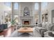 High-ceilinged living room with a large fireplace and hardwood floors at 4282 Preserve N Pkwy, Greenwood Village, CO 80121