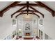 Two-story living room with high ceilings, fireplace, and large windows at 4282 Preserve N Pkwy, Greenwood Village, CO 80121