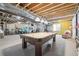 Large basement area featuring a pool table and a fitness area at 8977 Crossington Way, Lone Tree, CO 80124