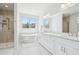 Bright bathroom features a soaking tub, walk-in shower, and dual sink vanity at 8977 Crossington Way, Lone Tree, CO 80124