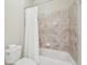 Bathroom with shower and neutral tile at 8977 Crossington Way, Lone Tree, CO 80124