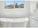 Close up of a soaking tub with view from window at 8977 Crossington Way, Lone Tree, CO 80124