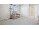 Bedroom featuring a chair, sliding closet, and carpet flooring at 8977 Crossington Way, Lone Tree, CO 80124