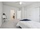 Bright bedroom with neutral paint, large closet, and adjacent bathroom entrance at 8977 Crossington Way, Lone Tree, CO 80124