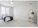 Light and bright bedroom with carpet and view from window at 8977 Crossington Way, Lone Tree, CO 80124