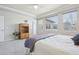 Bright main bedroom with large windows, neutral walls, and plush carpeting at 8977 Crossington Way, Lone Tree, CO 80124