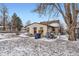 Backyard featuring a patio and grill in a fenced yard and with snow covered ground at 1390 W Gill Pl, Denver, CO 80223