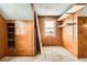 Bedroom with paneled walls, drawers and closet, and a window for natural light at 1390 W Gill Pl, Denver, CO 80223