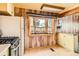 Bright kitchen with a large bay window providing natural light at 1390 W Gill Pl, Denver, CO 80223