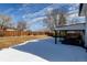 Large backyard featuring a covered patio, spacious lawn, and privacy fencing at 315 E 112Th Dr, Northglenn, CO 80233