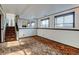 Spacious basement with staircase, mirror, and two windows at 315 E 112Th Dr, Northglenn, CO 80233