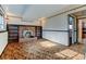 Spacious basement showcasing a brick fireplace flanked by built-in wooden shelves at 315 E 112Th Dr, Northglenn, CO 80233